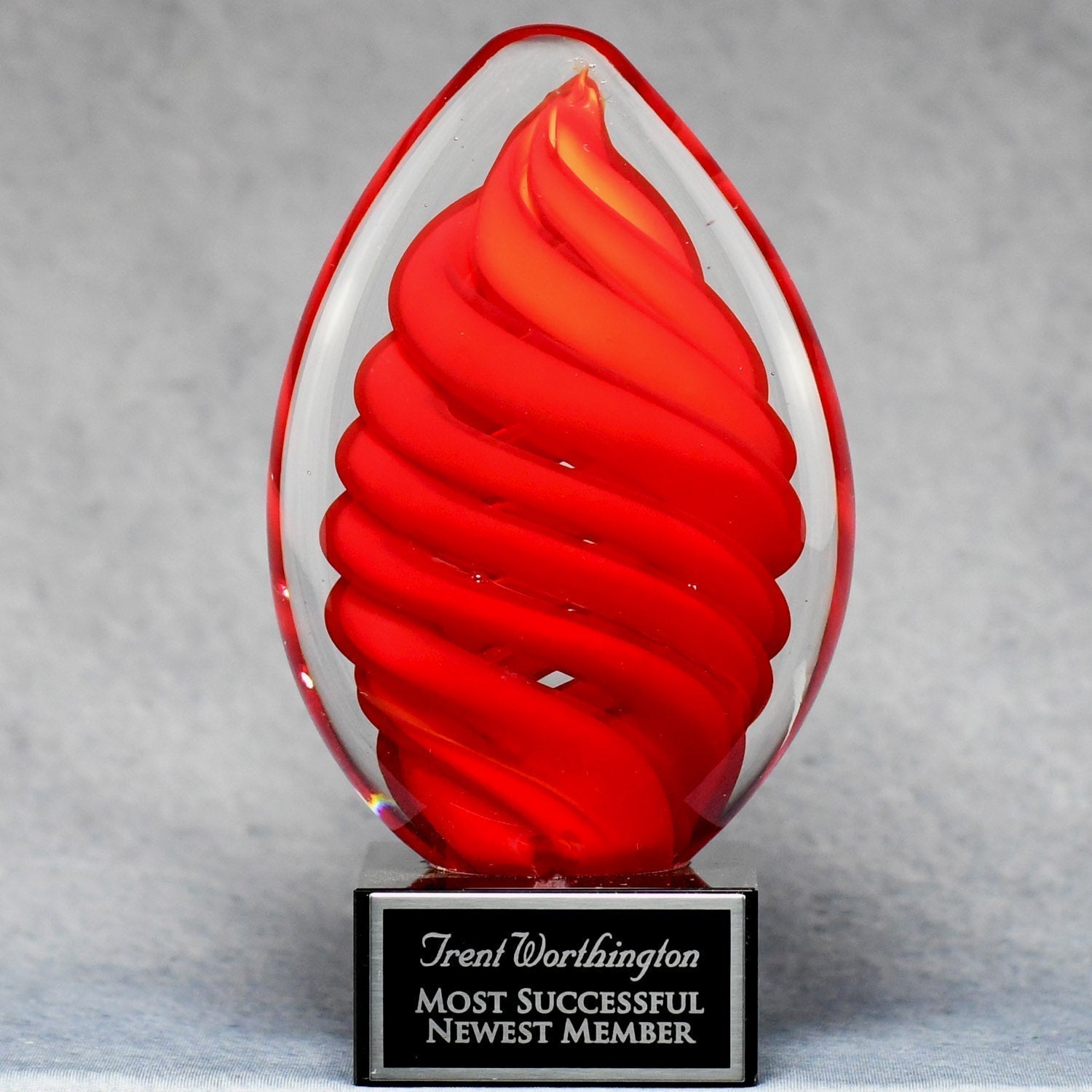 Red Swirl Egg On Black Glass Base | Global Recognition Inc